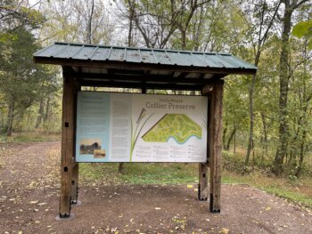 The Park’s informational kiosk includes wooden posts reused from the Collier family’s former barn and corn crib. The sign has intentionally been placed at the former barn site.